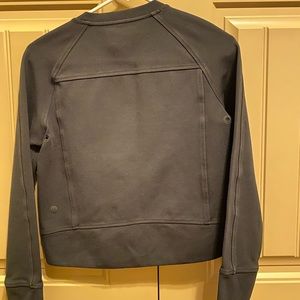 A black lululemon fitted sweatshirt